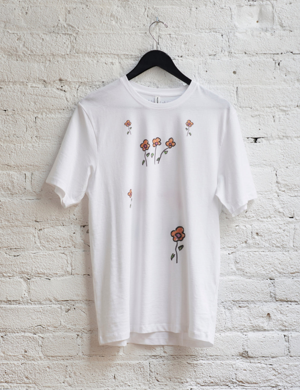 Maya wears the Kotn x KWW Little Flowers Essential Crew in White